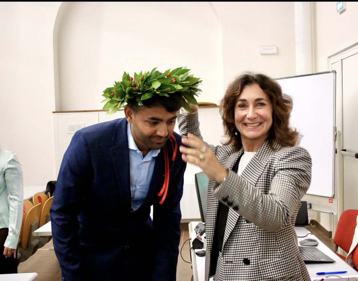 Usama at his graduation at Sapienza Università di Roma, wearing the laurel wreath